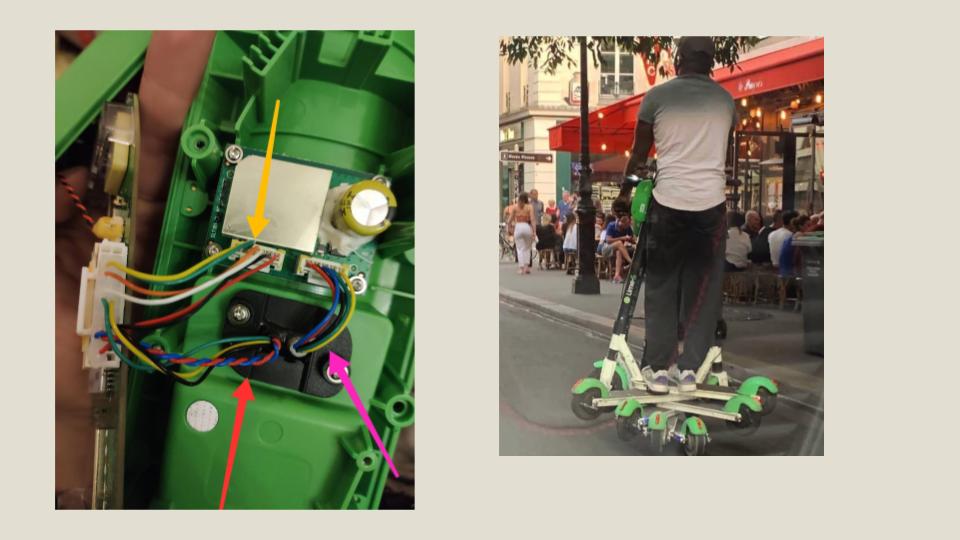 Inside the Lime brain. The pink arrow points to the only wires going to the rest of the scooter.